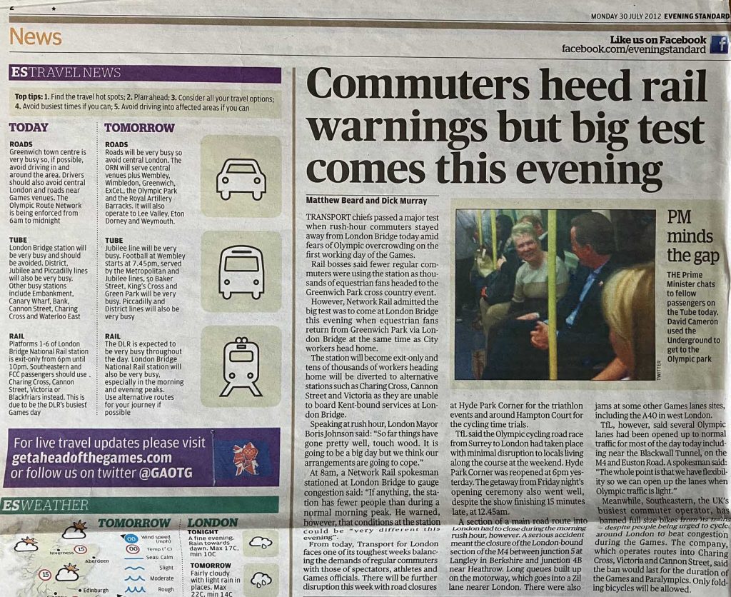 Photo of part of page 2 of London Evening Standard (newspaper) on Monday 30 July 2012. Article headlined 'Commuters heed rail warnings but big test comes this evening'. Alongside the article, the travel news is all about hotspots associated with the Games.