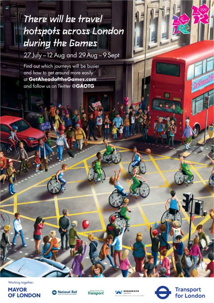 Poster for the London 2012 Games. main image is of wheelchair basketball players playing a game, on a yellow-box road junction surrounded by pedestrians, traffic and buildings. The main text reads "There will be travel hotspots across London during the games. 27 July - 12 Aug and 29 Aug - 9 Sept. Find out which journeys will be busier and how to get around more easily at GetAheadoftheGames.com and follow us on Twitter @GAOTG".