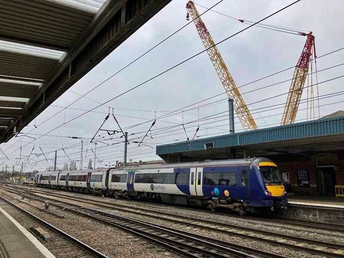Northern Class 170 unit leaving platform 4, with a crane in the background but no footbridge.