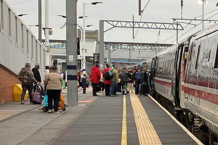 People getting on and off the train at Peterborough.